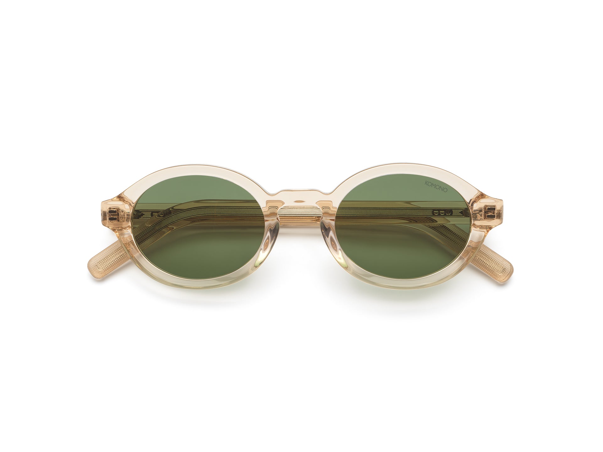 komono-jace-champagne-lunettes-de-soleil-ovales-en-ac-tate-verres-polaris-s-tail image 1