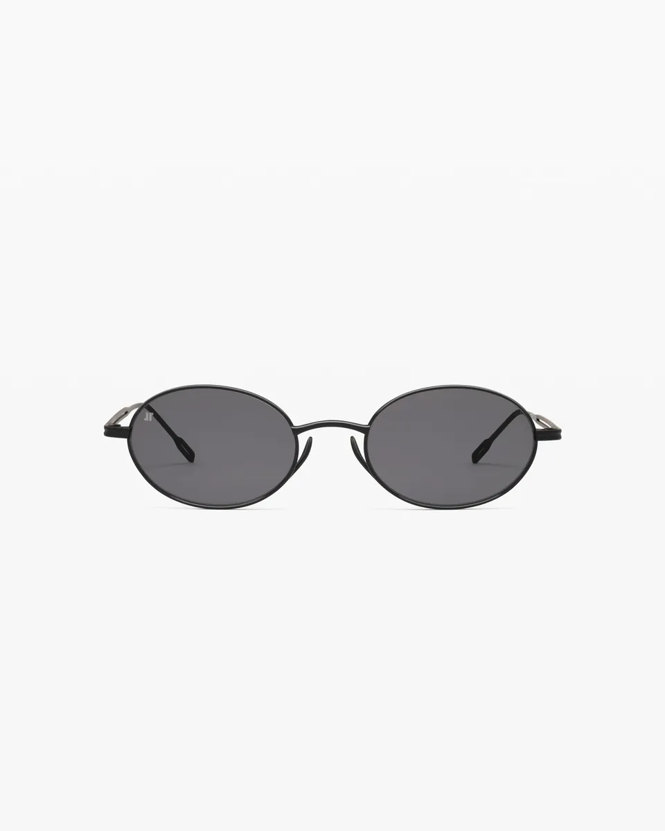 jimmy-fairly-la-elvie-lunettes-de-soleil-ovales-en-titane-noires-homme image 1